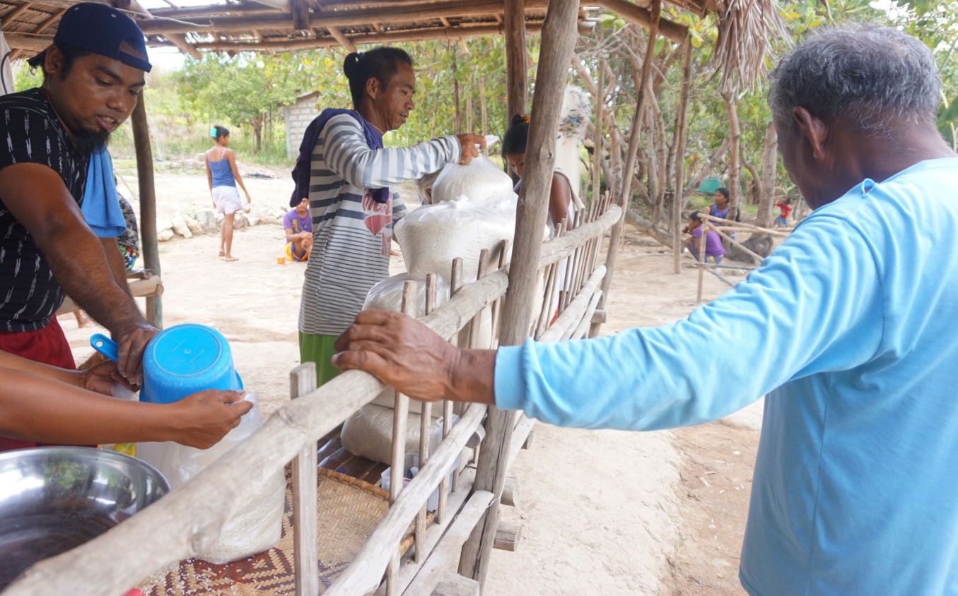 Volunteers helped out in repacking rice for the emergency food relief